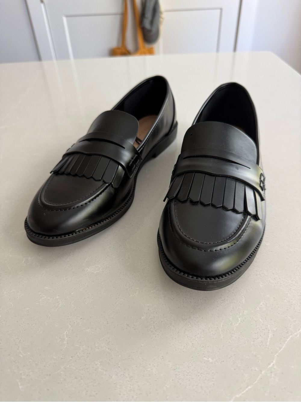 Classic Black Kiltie Penny Loafers for women